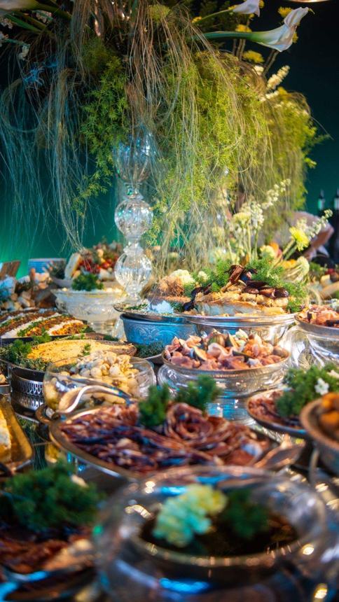 A long buffet of Indian dishes at a wedding