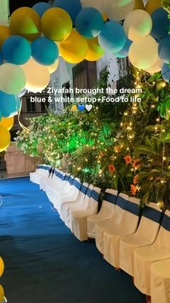 Blue and white themed seating with balloons