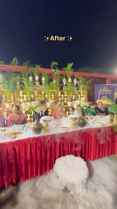 A dressed family table with red skirting and fog