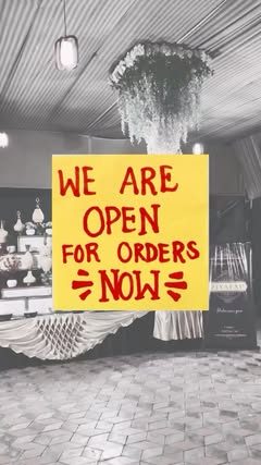 Buffet counter with a We are open for orders sign